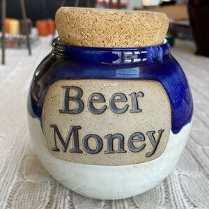 Glazed pottery coin jar w/ cork top. Blue/tanish gray. Ceramic circular kitschy